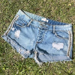 Blue Jean shorts with lace and silver embellishments. Womens 28